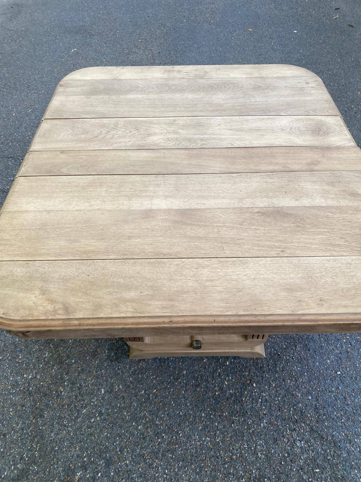 Rectangular Art Deco dining table with a central pedestal, stripped in solid oak.