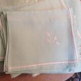 Old embroidered tablecloth in light green color