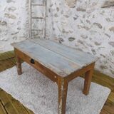 Patinated coffee table with a drawer