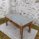 Patinated coffee table with a drawer