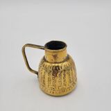 Persian jug in chiseled brass