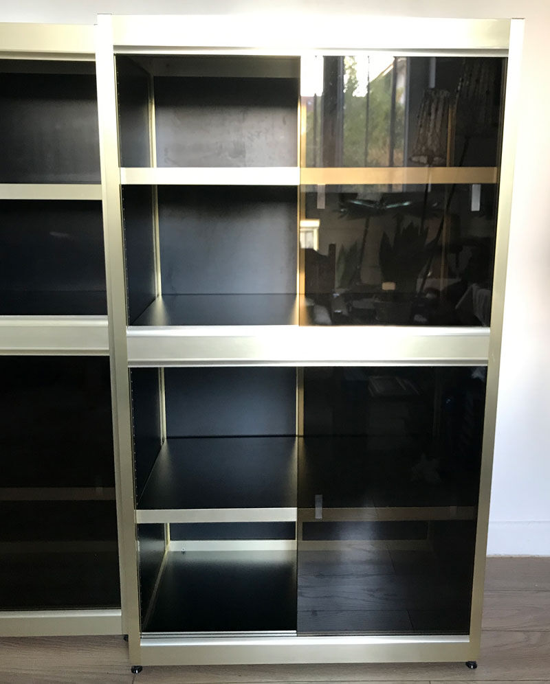 Shelves of black and gold windows