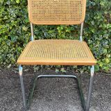 Wooden chair with caning in the style of Marcel Breuer.