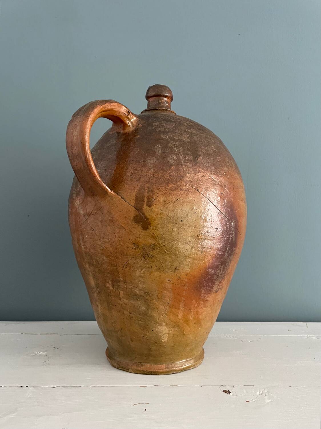 Large 19th century oil bottle in glazed earthenware