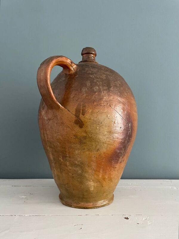 Grande bouteille à huile XIXème en terre vernissée