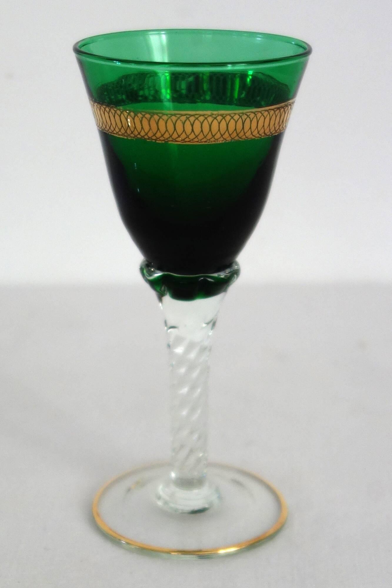 6 multicolored aperitif glasses with twisted legs