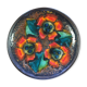 Enamelled sandstone plate with floral decoration