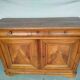 Very old in solid walnut.