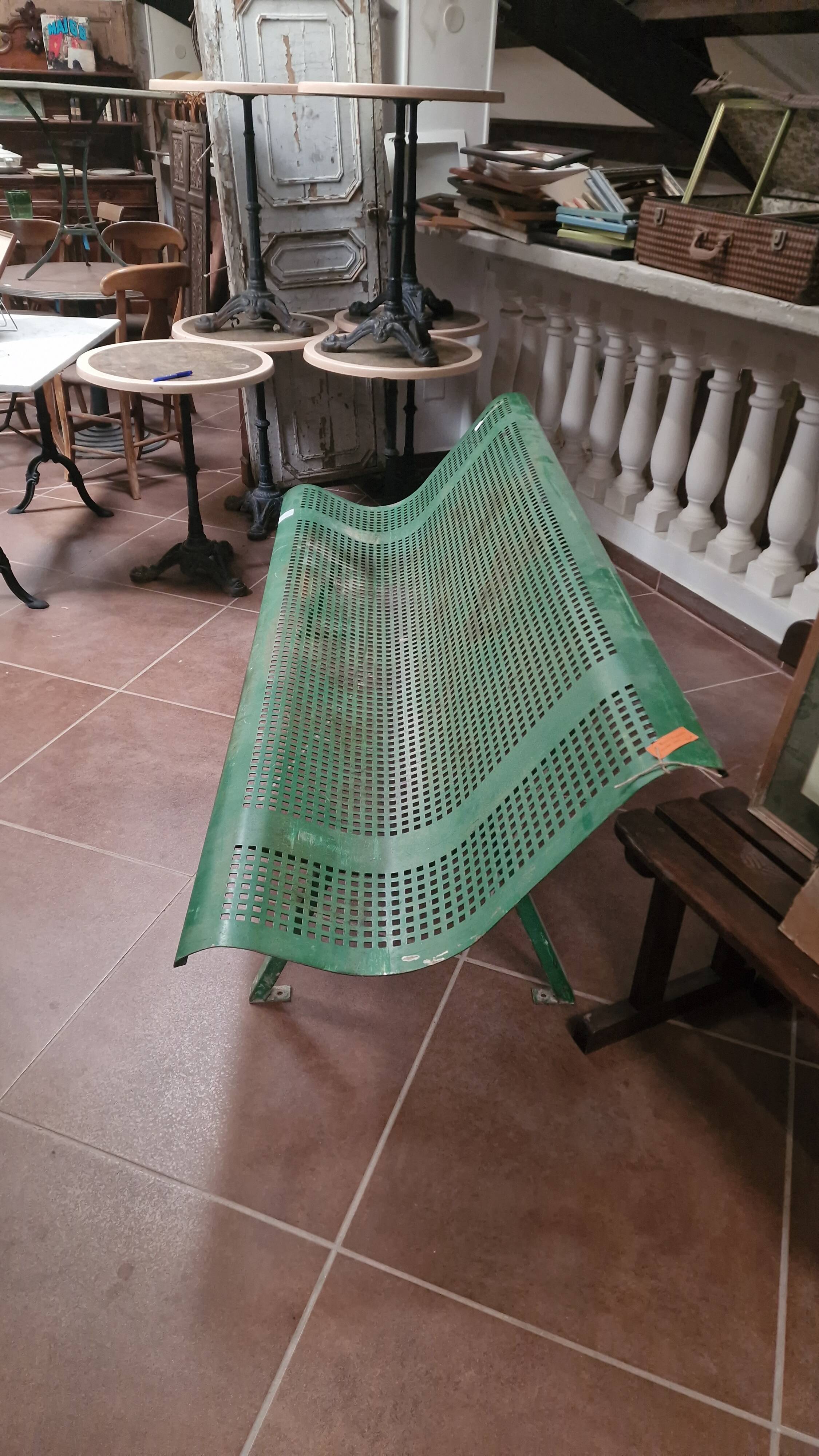 Vintage green perforated metal public bench