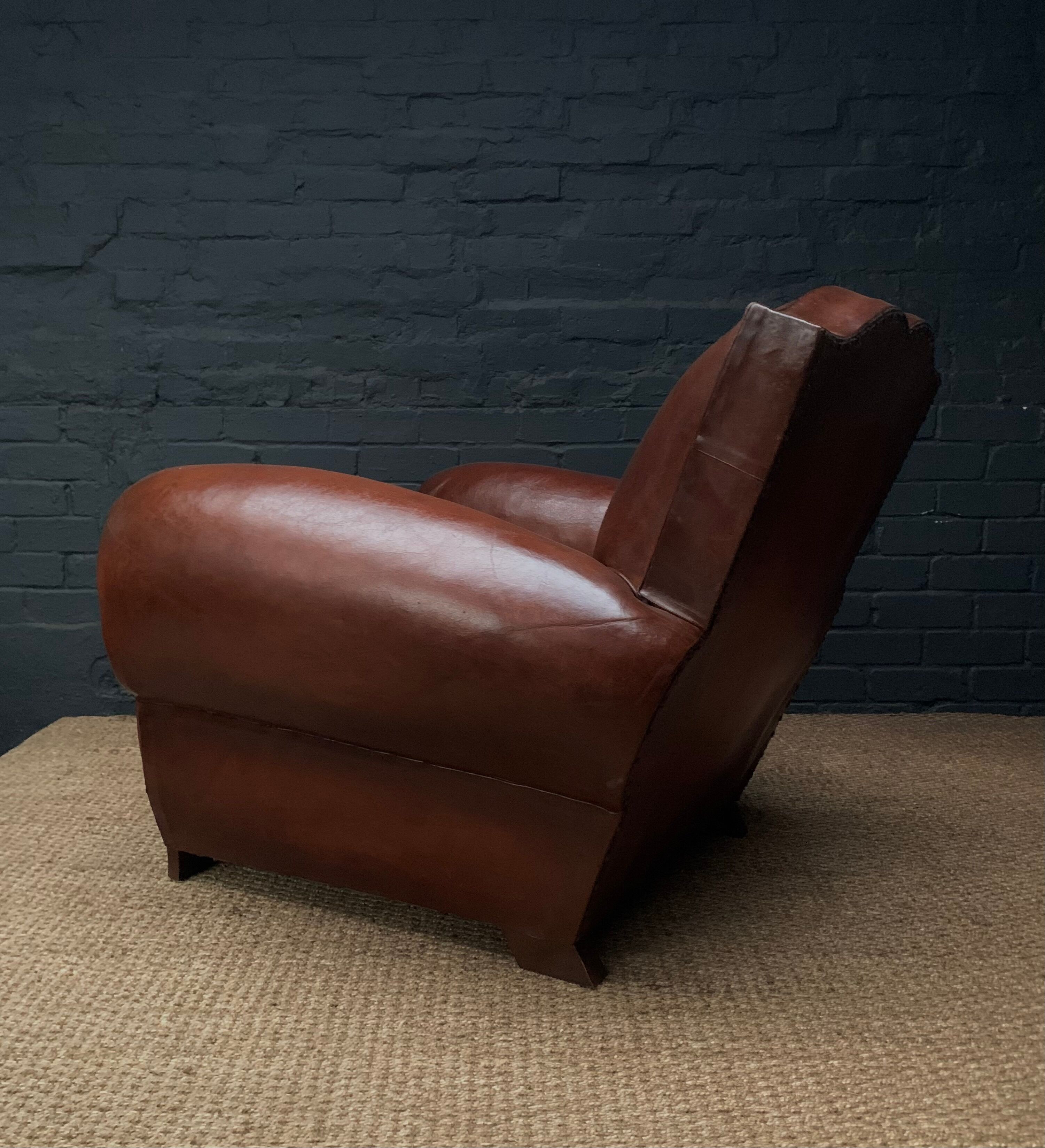 Leather club chair, havana moustache model, with cuban cigar arms, circa 1930's