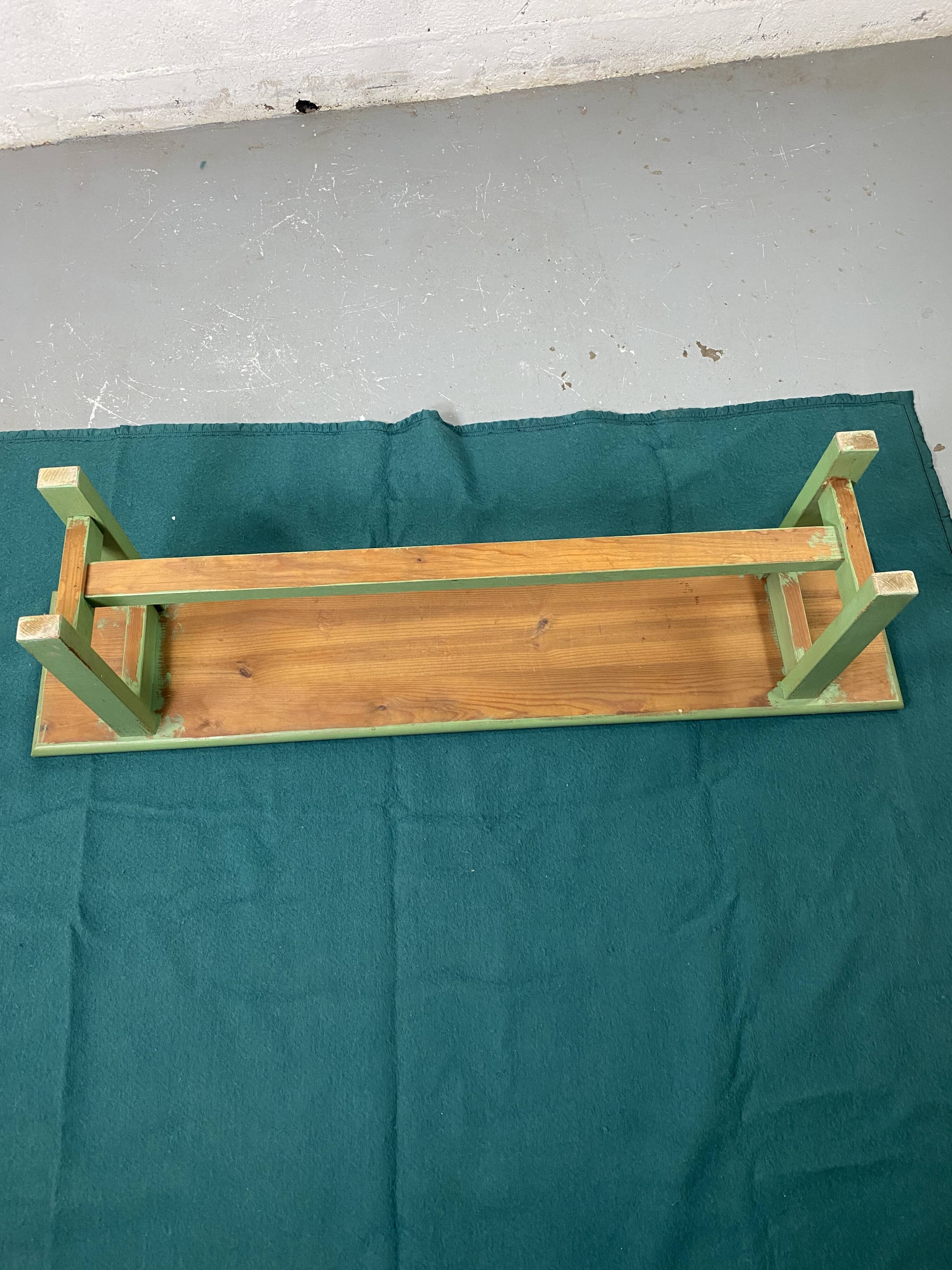 Green wooden bench