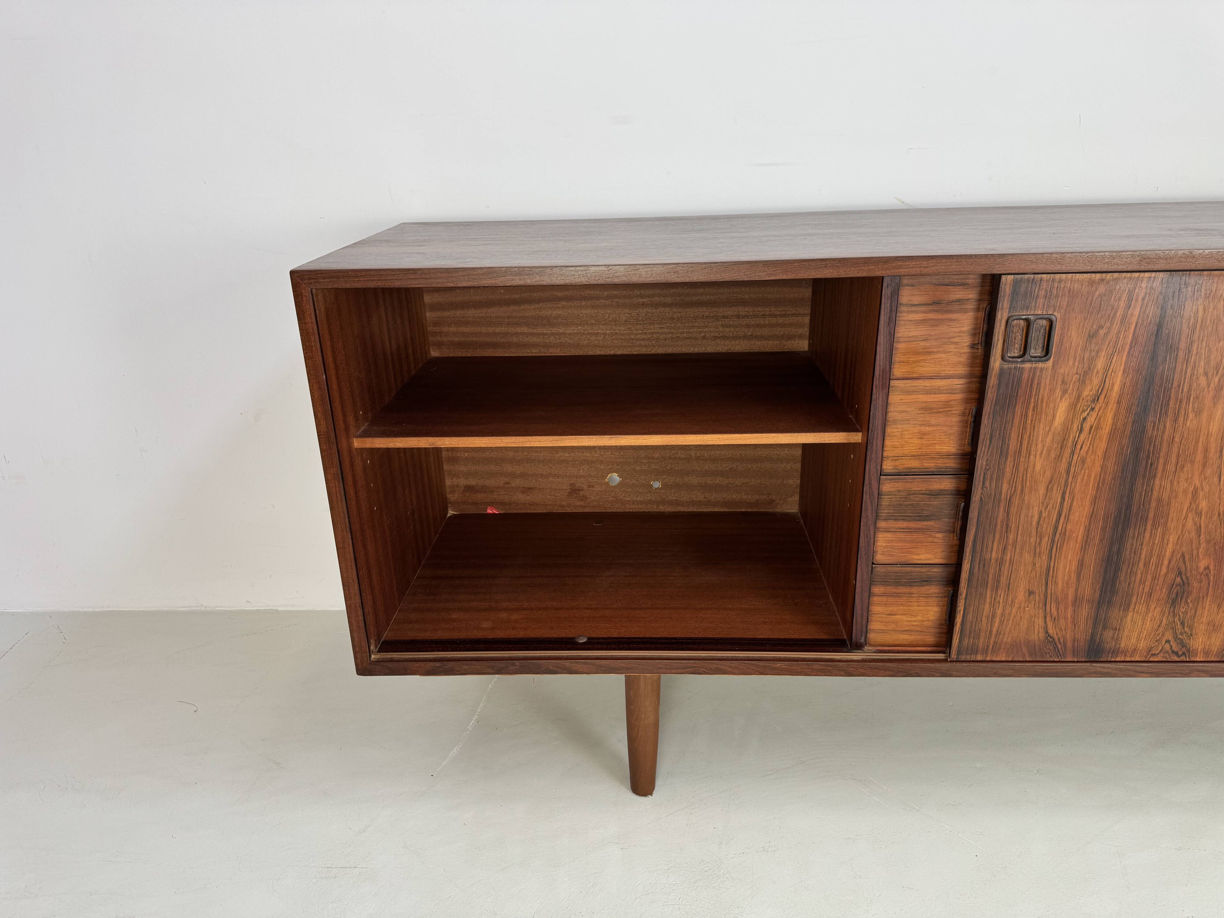 Danish rosewood vintage sideboard with sliding teak doors from the 1960s