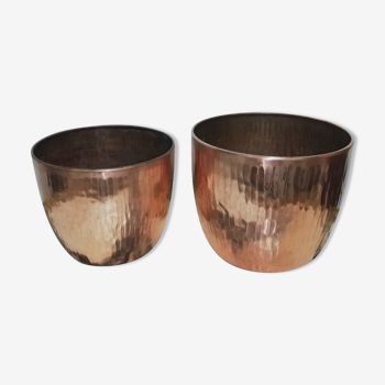 Duo of hammered copper pot covers