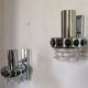 Pair of Space Age wall lights in chrome and green glass, 1970s.