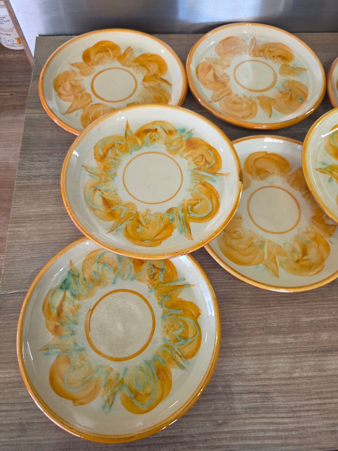 8 vintage dessert plates with a signed decoration.