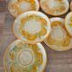8 vintage dessert plates with a signed decoration.