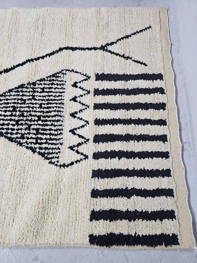 Handmade pure wool rug in black and white, size 150 x 250 cm.