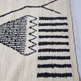 Handmade pure wool rug in black and white, size 150 x 250 cm.