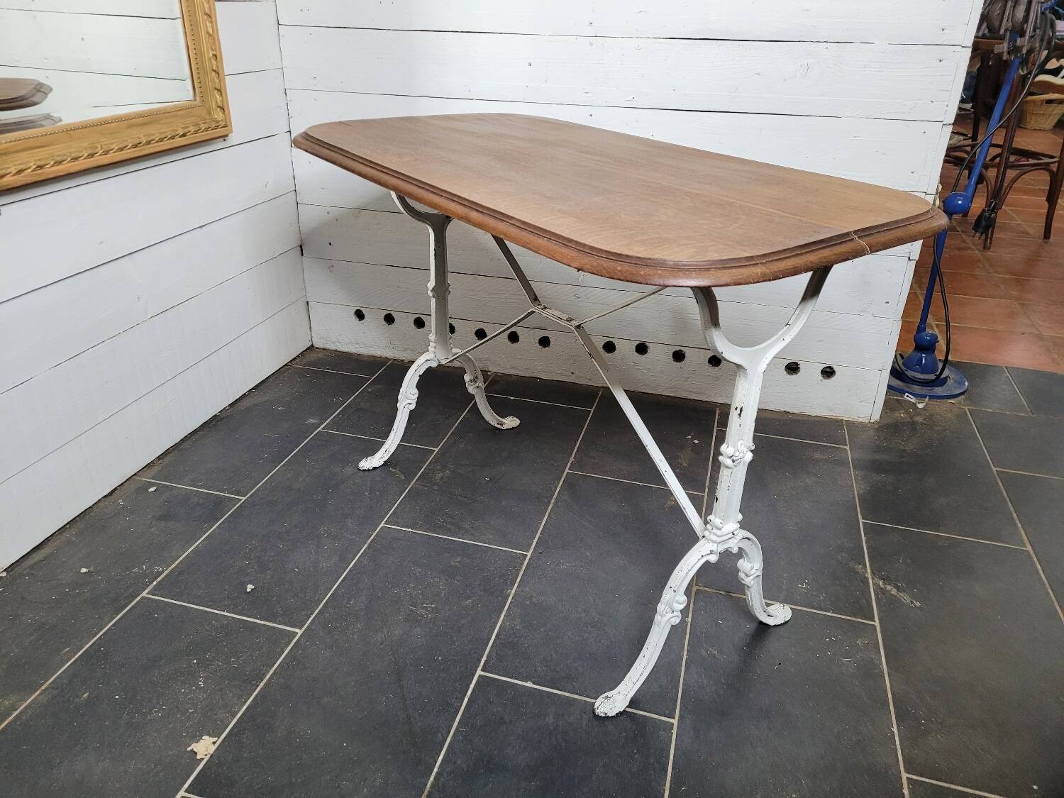 Bistro table with cast iron base and oak top