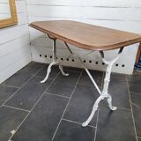 Bistro table with cast iron base and oak top