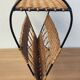 Antique magazine rack made of iron and woven rattan wicker