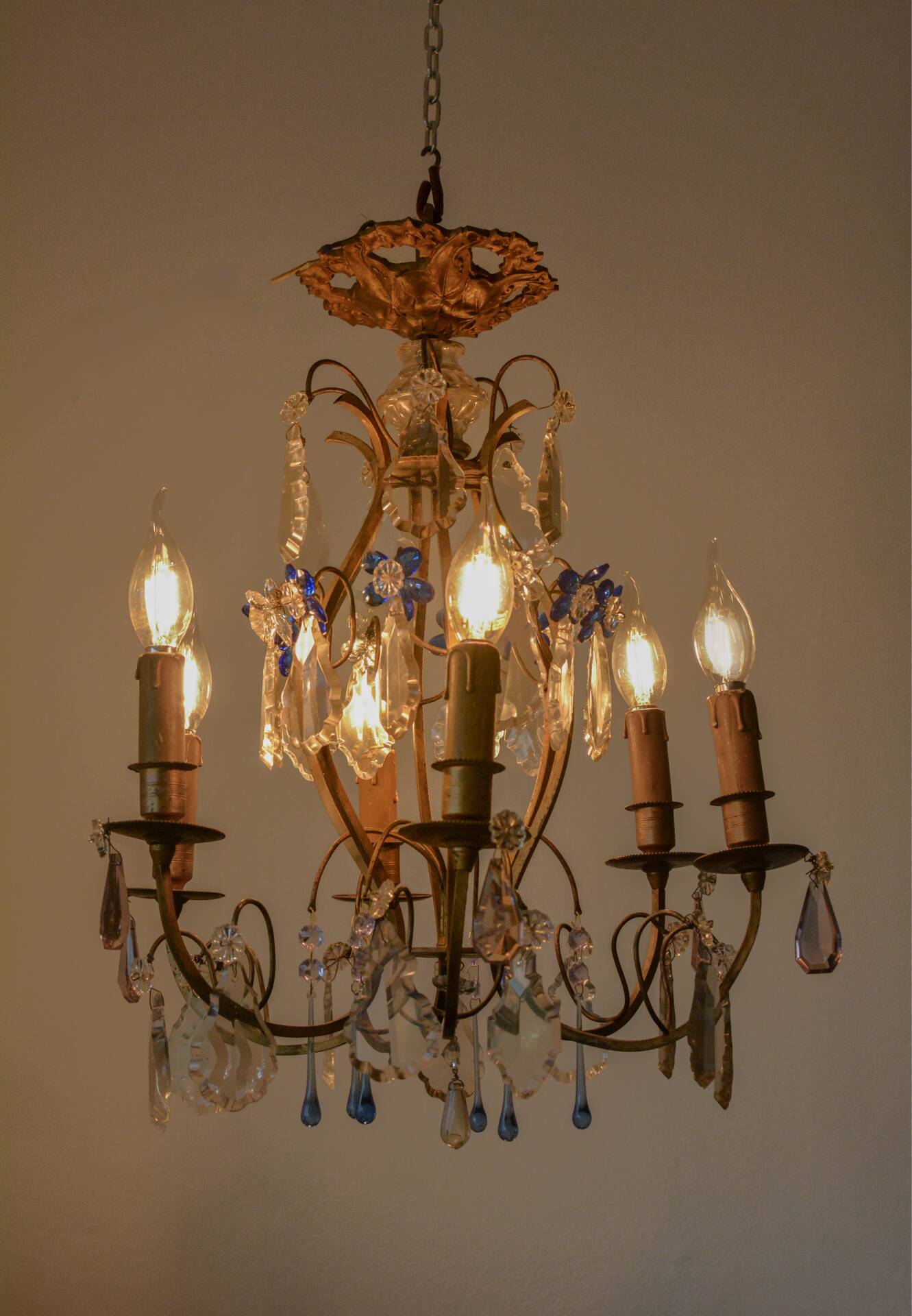 Antique French chandelier cage in gilded bronze and crystal, with blue pendants.