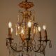 Antique French chandelier cage in gilded bronze and crystal, with blue pendants.