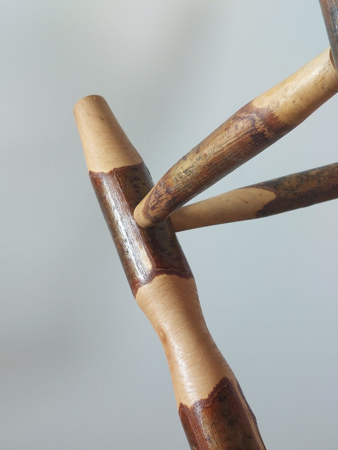 Pair of walnut stools sculpted in a vintage mid-century cross-section.