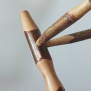 Pair of walnut stools sculpted in a vintage mid-century cross-section.