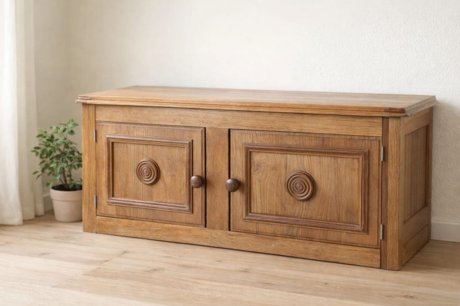 Low oak furniture in the Dudouyt style, with a sculpted front.