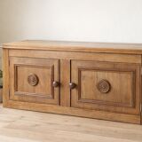 Low oak furniture in the Dudouyt style, with a sculpted front.