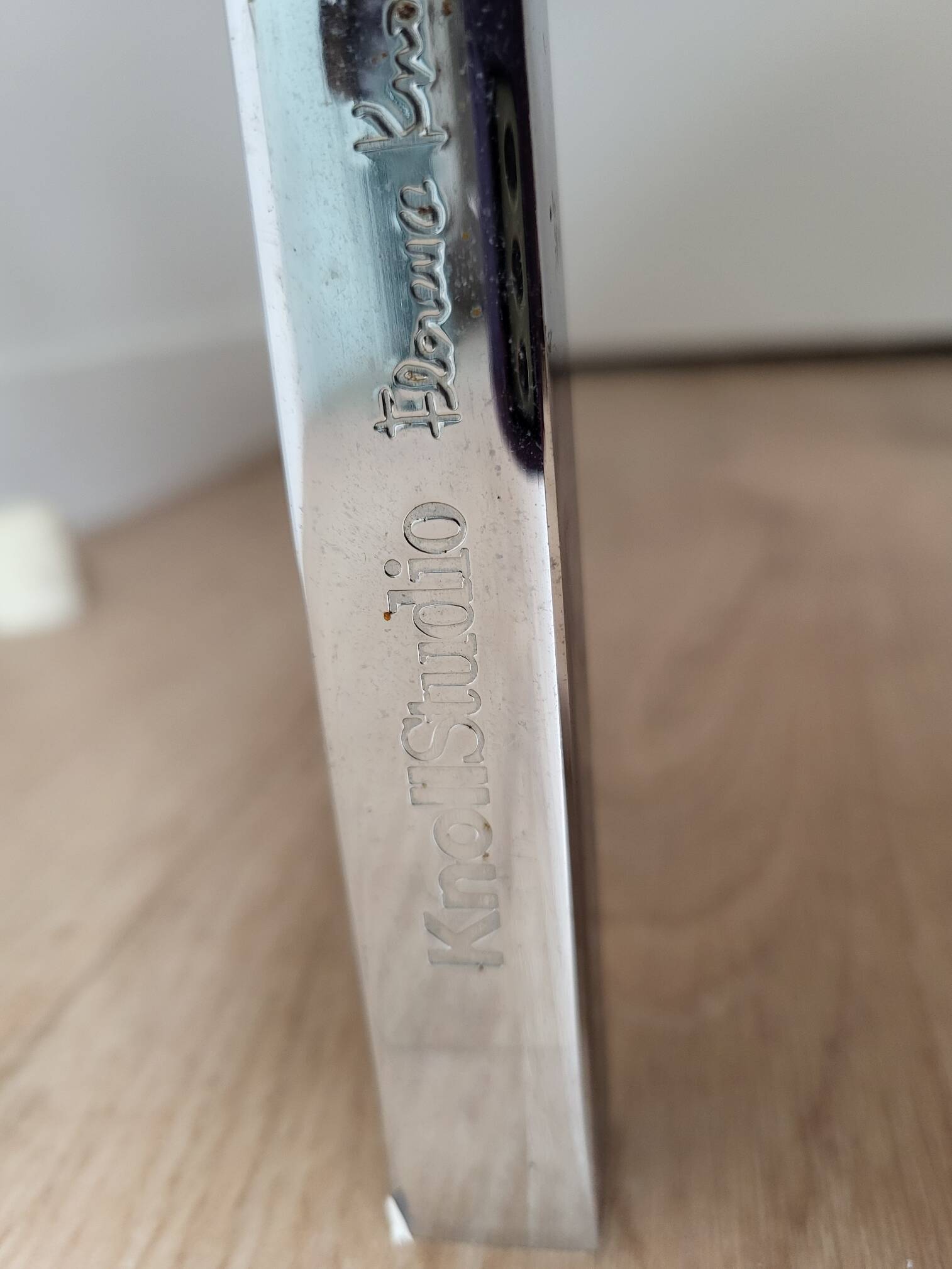 Knoll coffee table with smoked glass top and chrome metal.