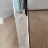 Knoll coffee table with smoked glass top and chrome metal.