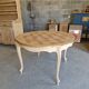 Round table made of cherry wood, sanded and varnished.