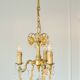 Small vintage brass chandelier with amber crystal pendants.