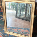Old rectangular golden mirror baguette with beaded row