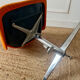 Chrome metal chair with orange fabric from the 70s.