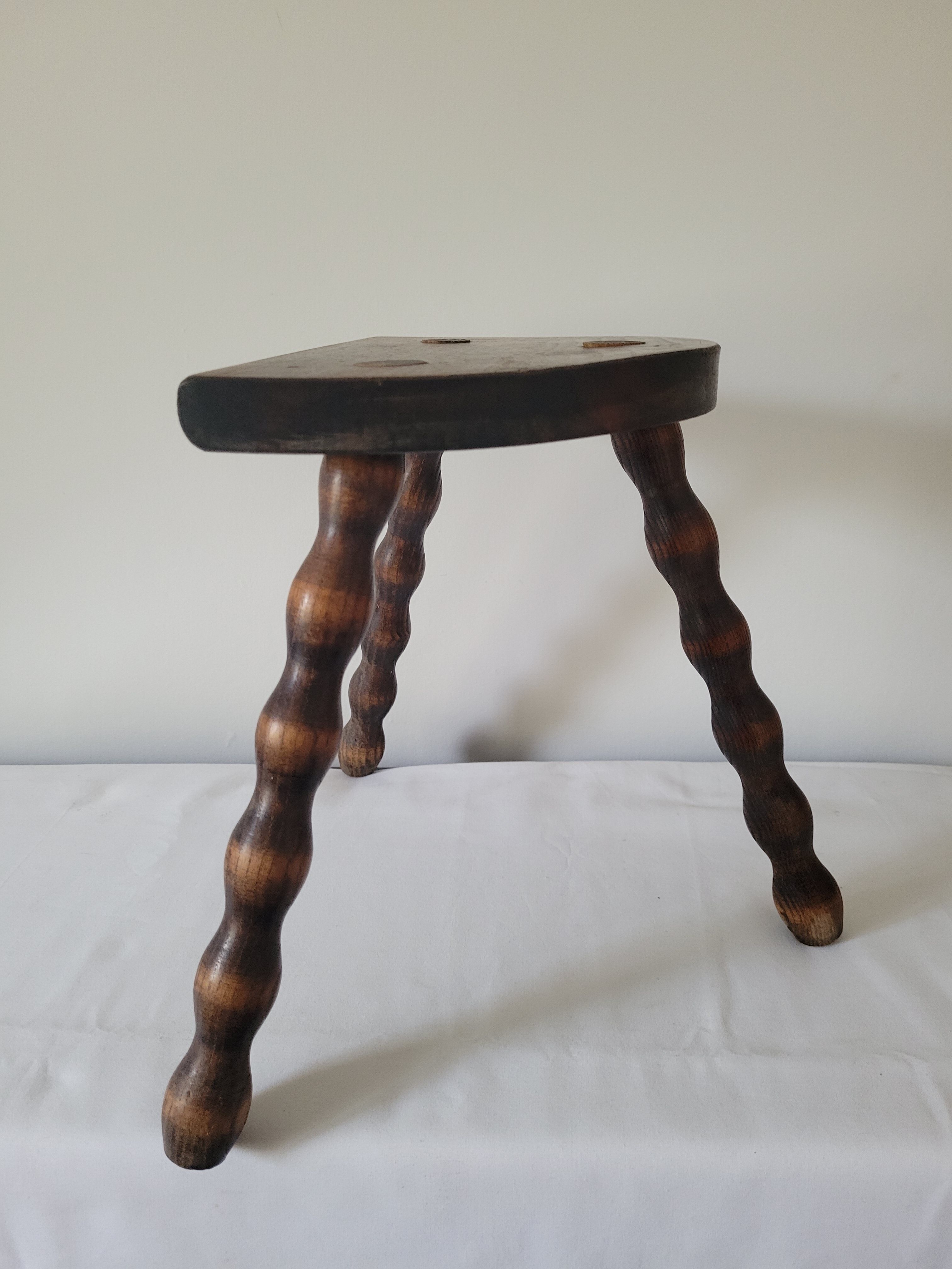 Tripod stool with turned wooden legs