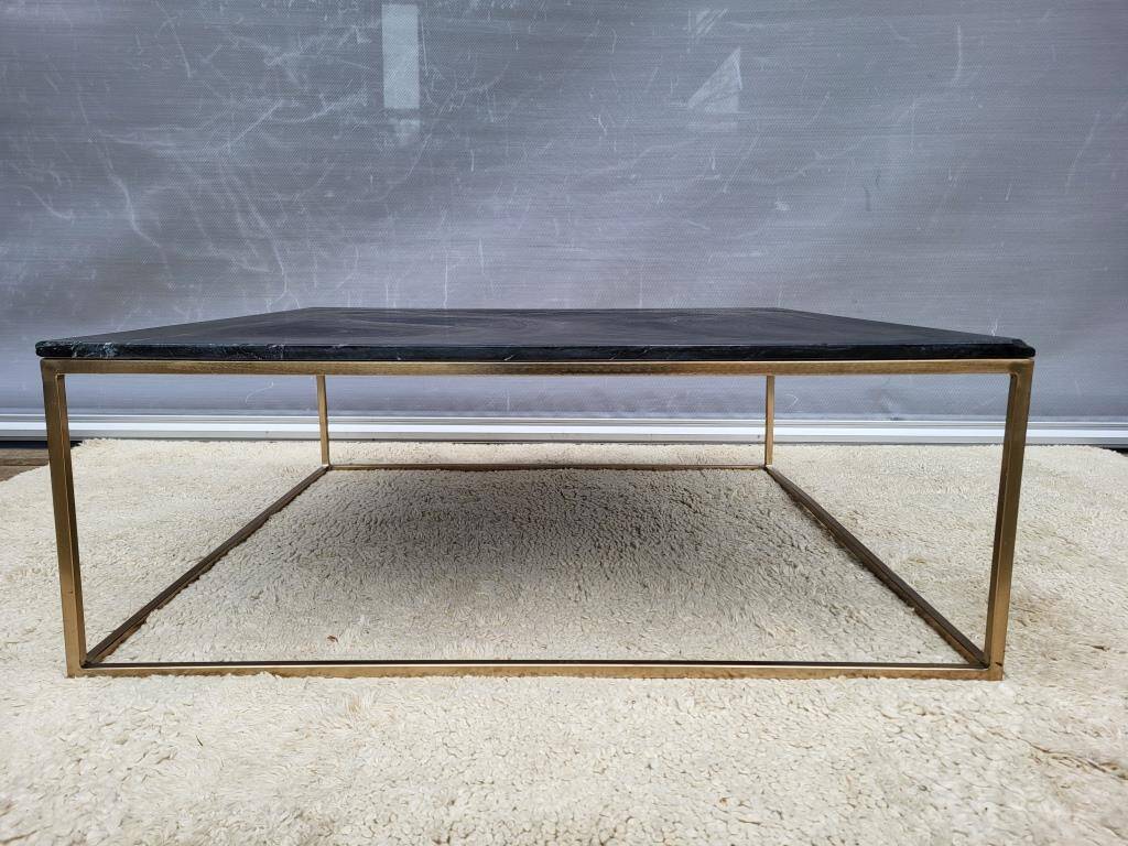 Coffee table or black marble and brass display "in its own juice"