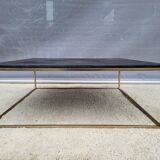 Coffee table or black marble and brass display "in its own juice"