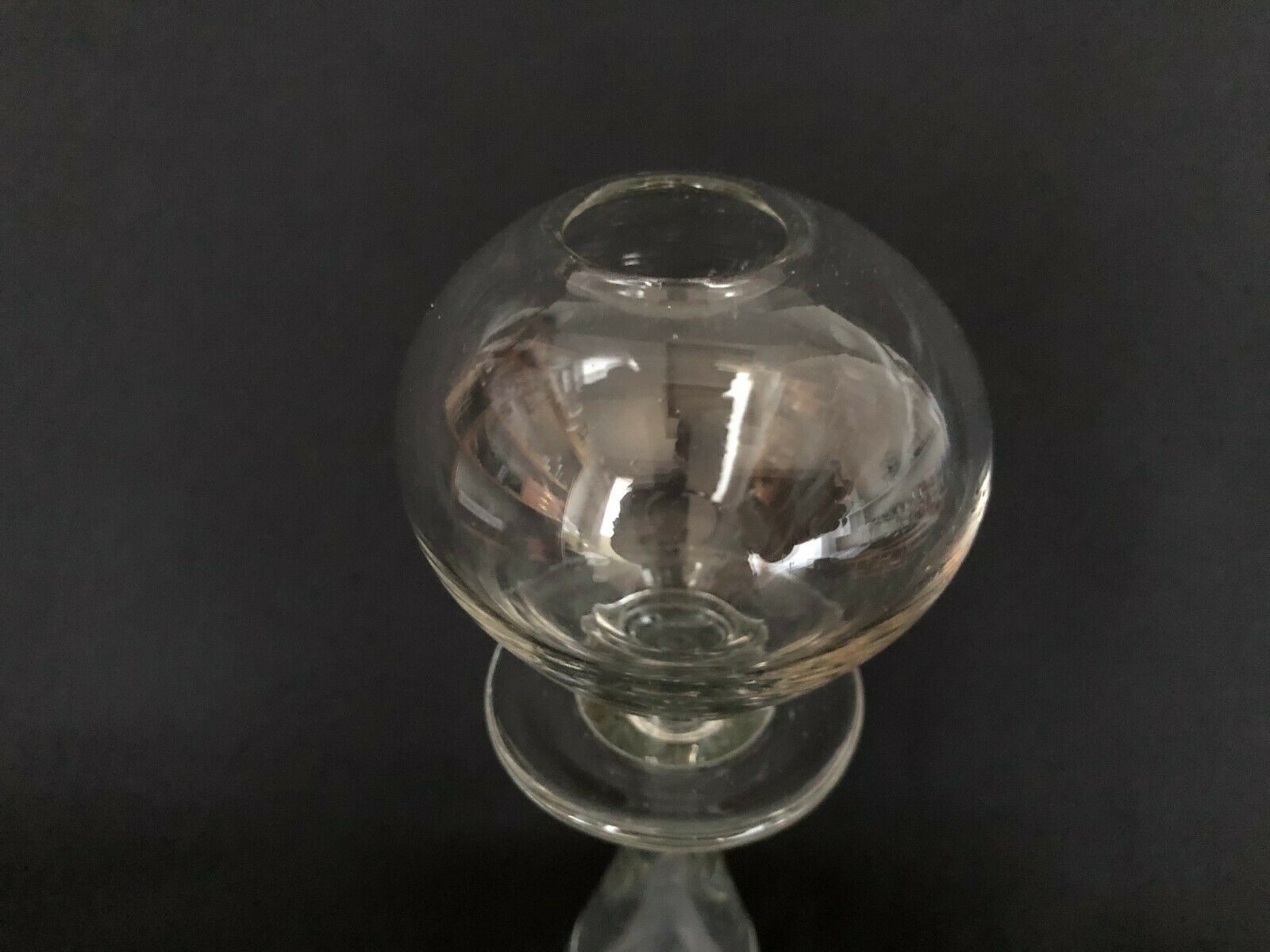 Glass oil lamp blows on foot shower