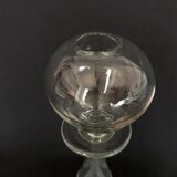 Glass oil lamp blows on foot shower