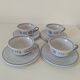 Glazed earthenware cups and saucers