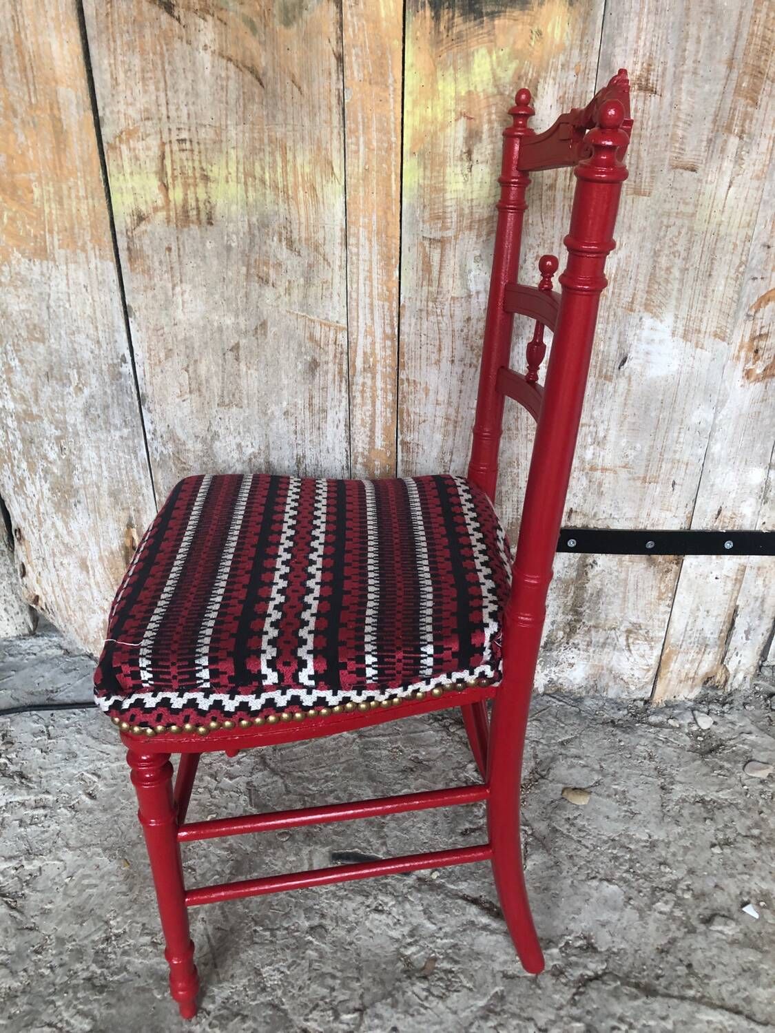 Red carved wood bedroom chair & vintage striped fabric seat