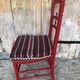 Red carved wood bedroom chair & vintage striped fabric seat