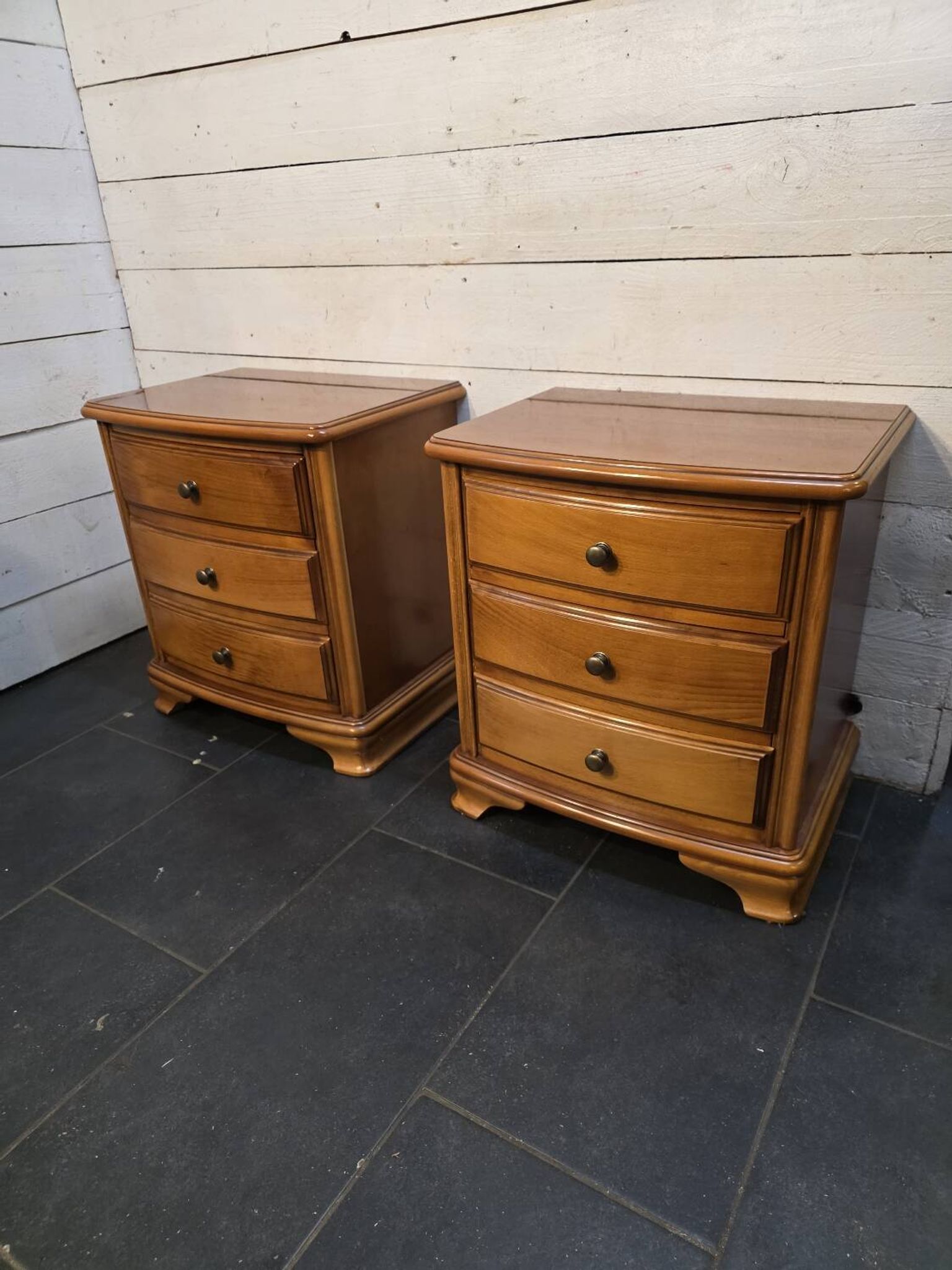 Pair of Louis Philippe style bedside tables in cherry wood.