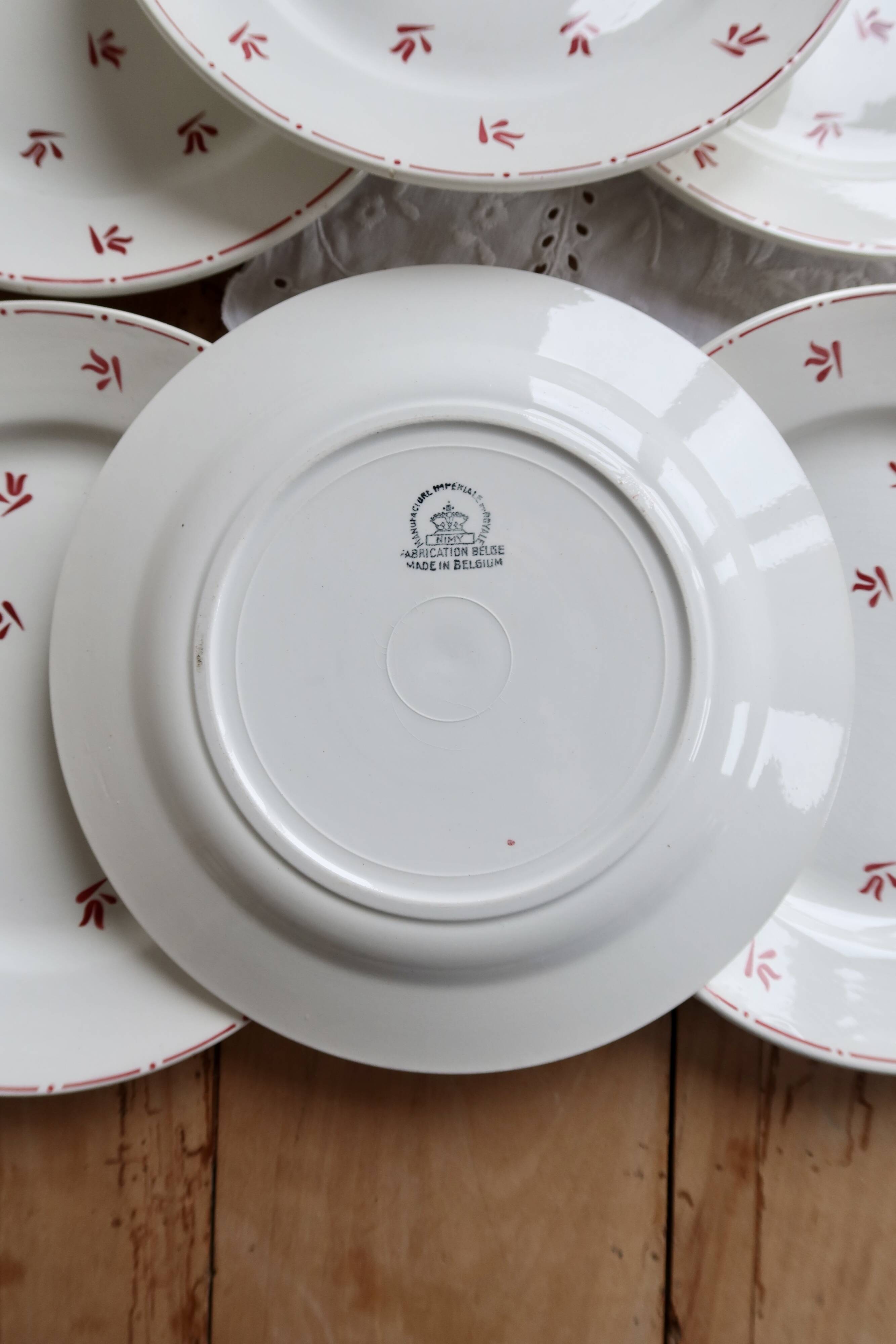 6 vintage flat plates from Nimy with red patterns.