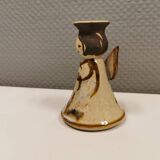 Ceramic candle holder, in the shape of an angel, signed at the bottom.