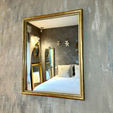 Antique gilded mirror with pearl and gold leaf.