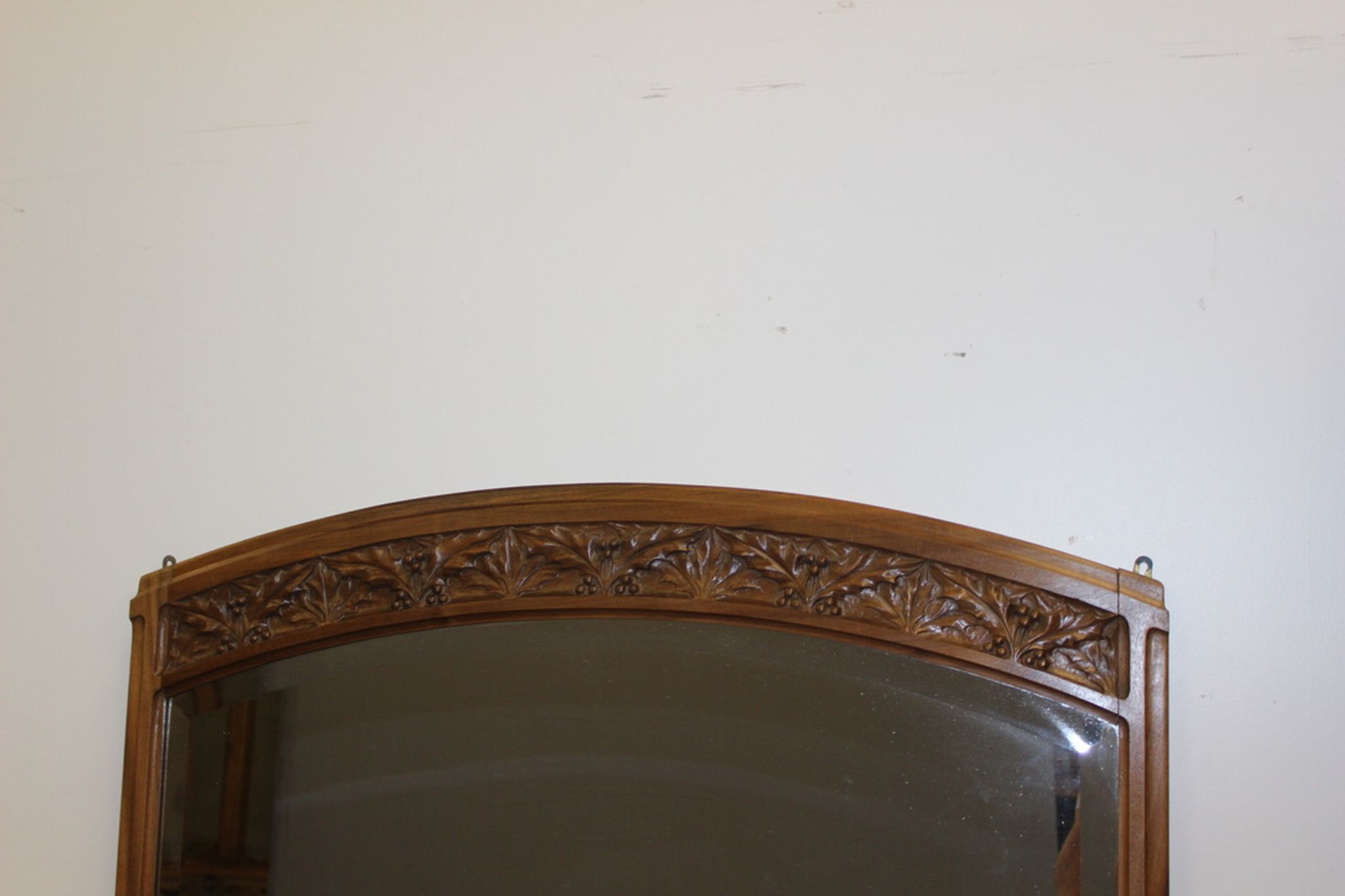Art Nouveau walnut mirror decorated with holly leaves circa 1900 105x171cm